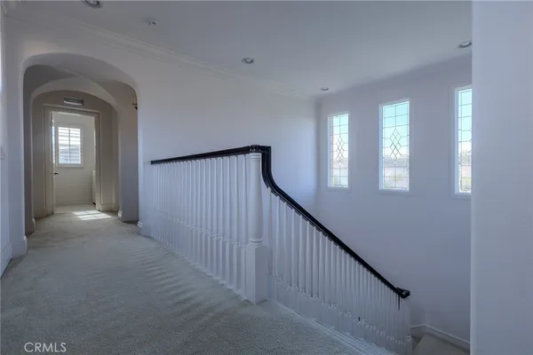 a view of a hallway with windows