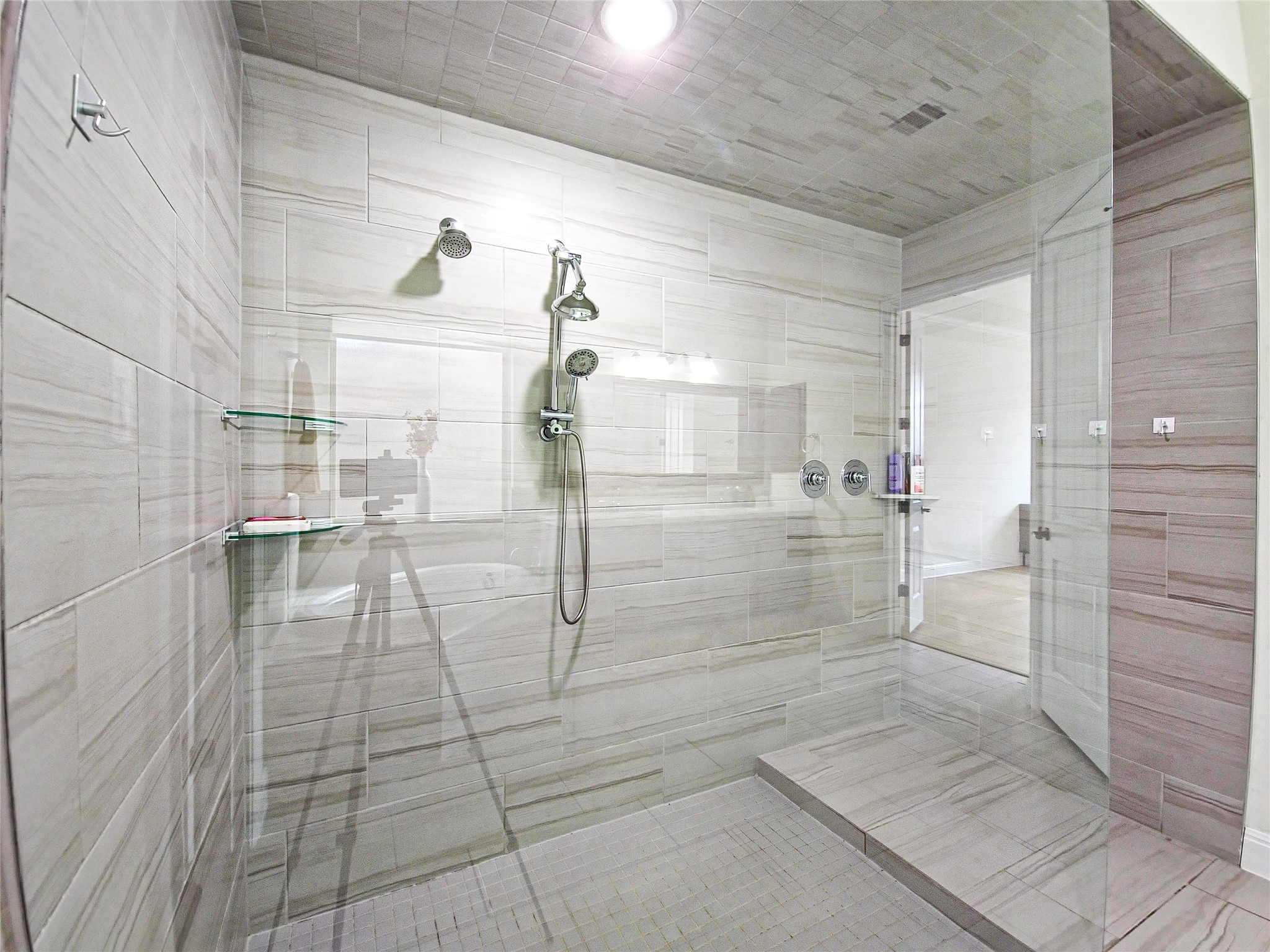 813 Sunny Ridge Drive Leander, TX 78641 - Photo 24 of 32 An oversized, walk-in shower with sleek tile work and dual shower heads awaits.