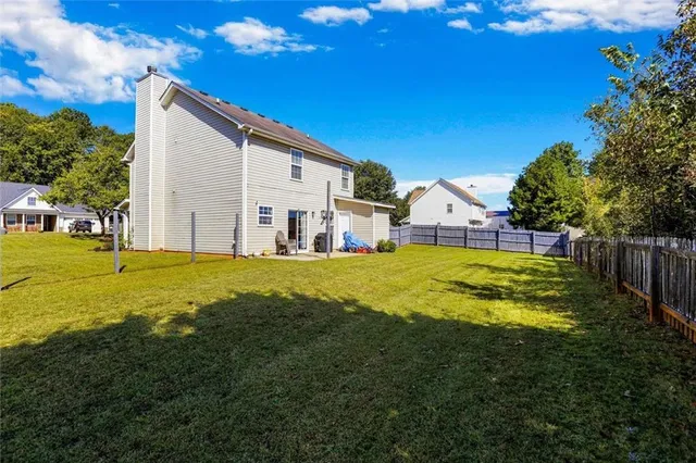 a view of a house with a yard