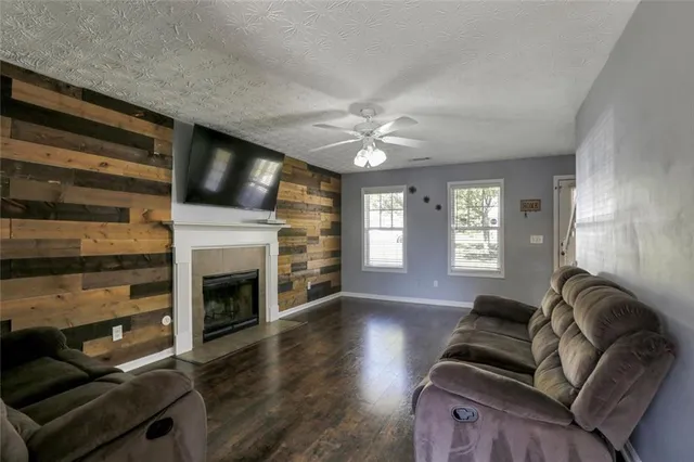 a living room with furniture fireplace and window