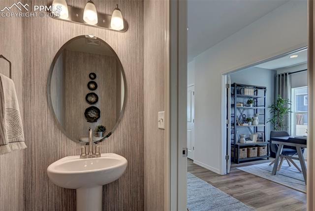 5057 Truscott Road Colorado Springs, CO 80925 - Photo 37 of 48 Bathroom featuring hardwood / wood-style floors