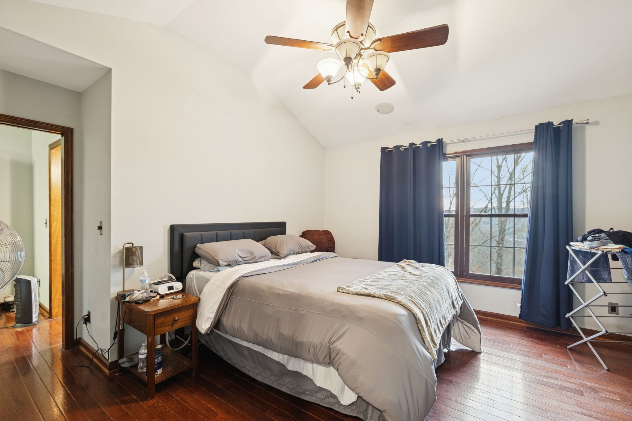 516 Rhotons Chapel Road Manchester, TN 37355 - Photo 20 of 52 a bedroom with a bed and a chandelier