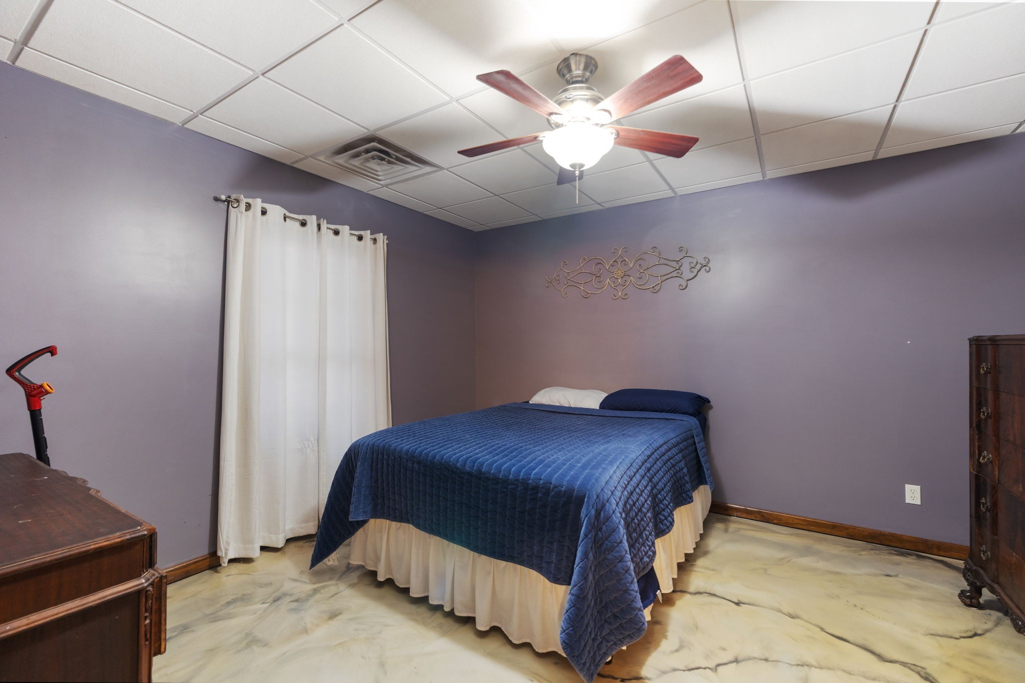 516 Rhotons Chapel Road Manchester, TN 37355 - Photo 33 of 52 a bedroom with a bed and a chandelier