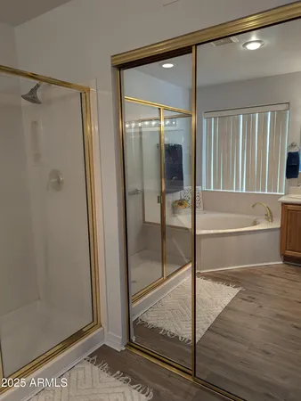 a bathroom with a glass shower door