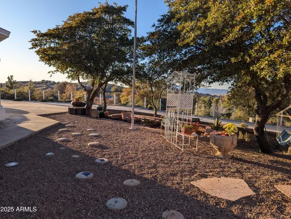 a view of a backyard with sitting area
