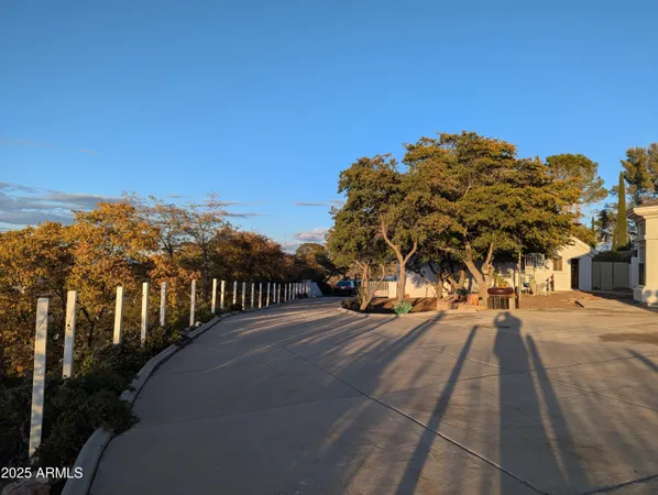 a view of a street with a building in the background