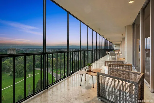 a view of balcony with furniture