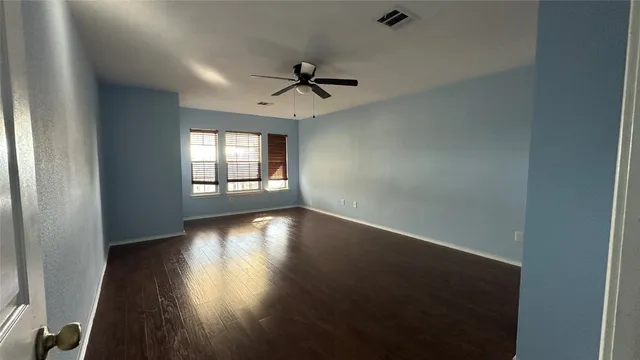 a view of room with wooden floor
