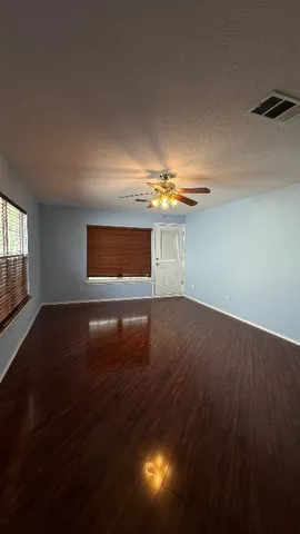 a bathroom with a sink a toilet a mirror and shower