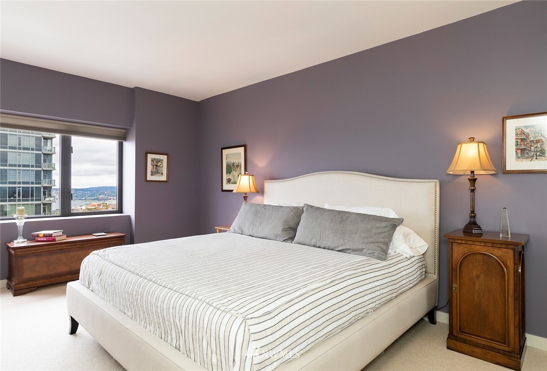 1301 Spring Street, Unit 18J Seattle, WA 98104 - Photo 19 of 25 a bedroom with a bed and window