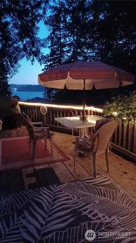 a patio with table and chairs