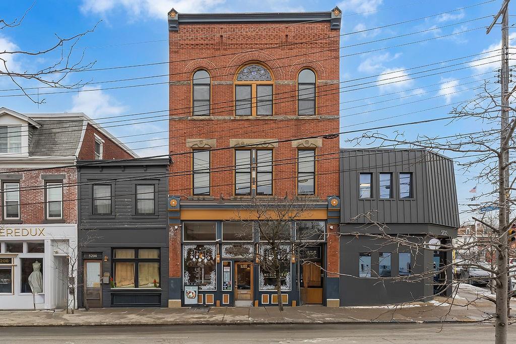 5202 Butler Street, Unit 1 Pittsburgh, PA 15201 - Photo 1 of 28 a front view of a building with glass windows