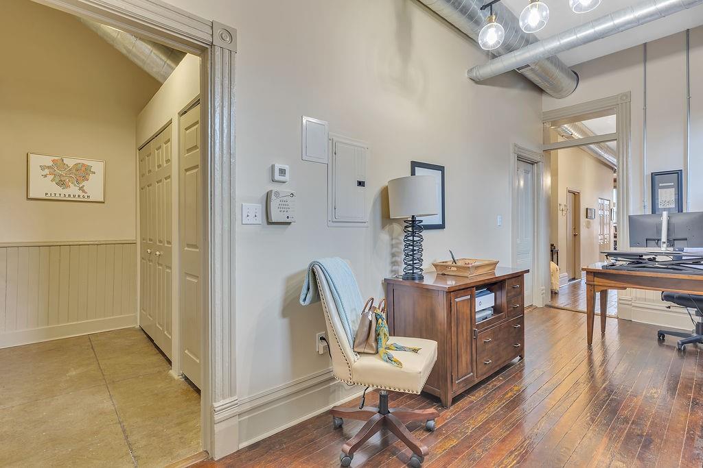 5202 Butler Street, Unit 1 Pittsburgh, PA 15201 - Photo 14 of 28 a view of a workspace with furniture and wooden floor