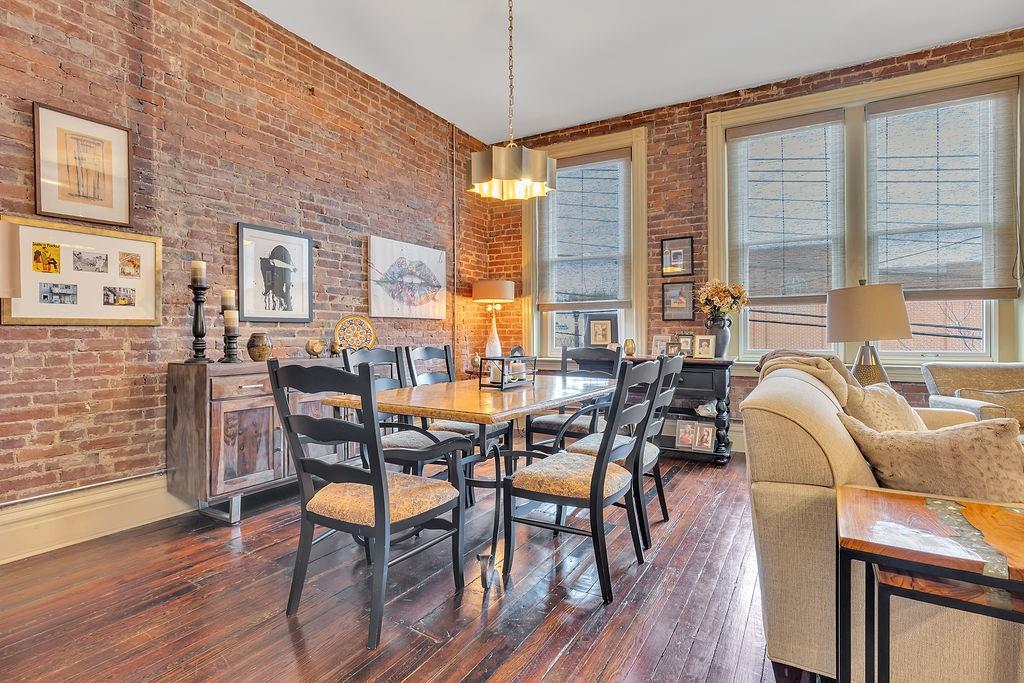 5202 Butler Street, Unit 1 Pittsburgh, PA 15201 - Photo 4 of 28 a dining room with furniture window and wooden floor