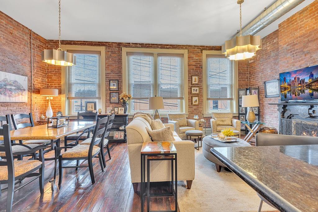 5202 Butler Street, Unit 1 Pittsburgh, PA 15201 - Photo 5 of 28 a living room with patio furniture and a large window