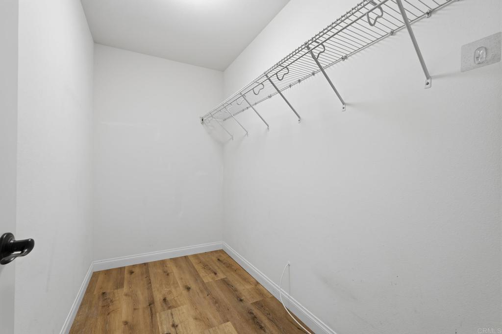 321 William Pittenger Place Fallbrook, CA 92028 - Photo 11 of 32 a view of a room with racks on the wall