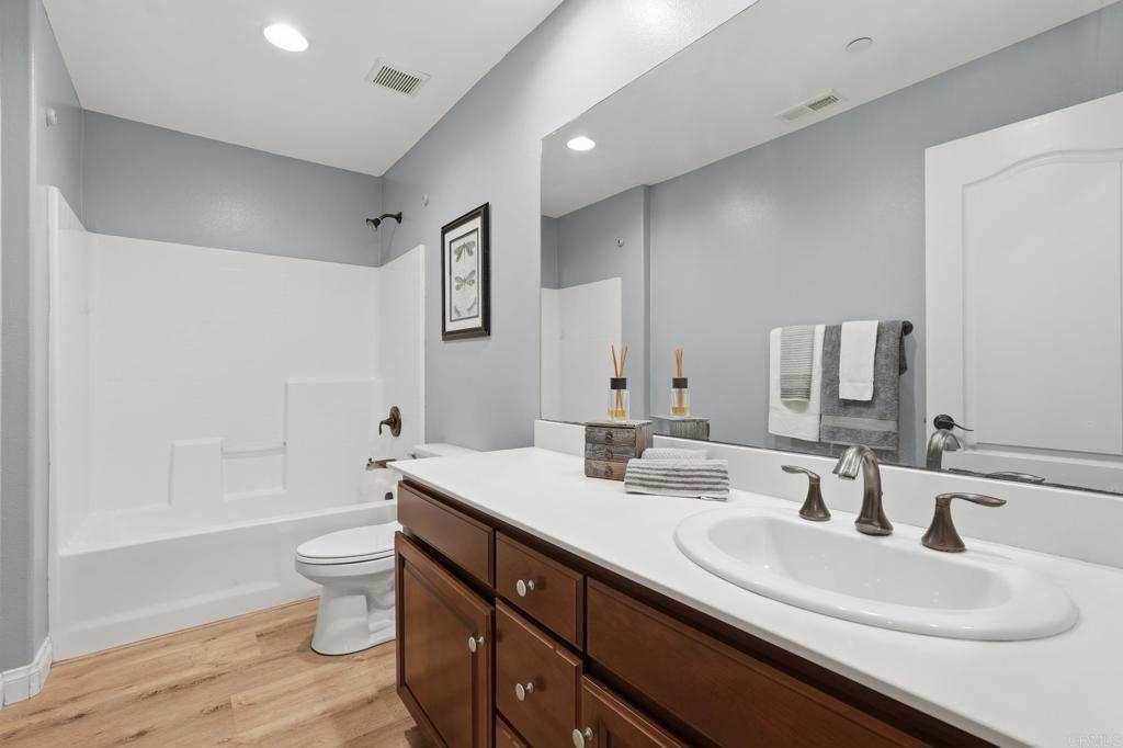 321 William Pittenger Place Fallbrook, CA 92028 - Photo 17 of 32 a bathroom with a sink and a mirror