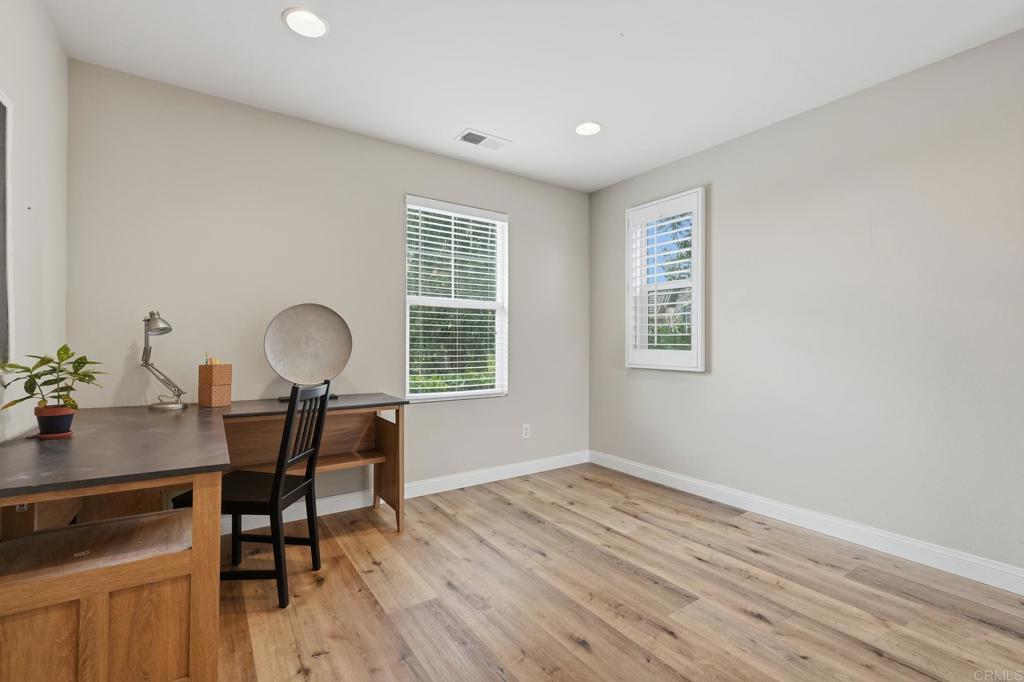 321 William Pittenger Place Fallbrook, CA 92028 - Photo 19 of 32 a view of a workspace with furniture and a window
