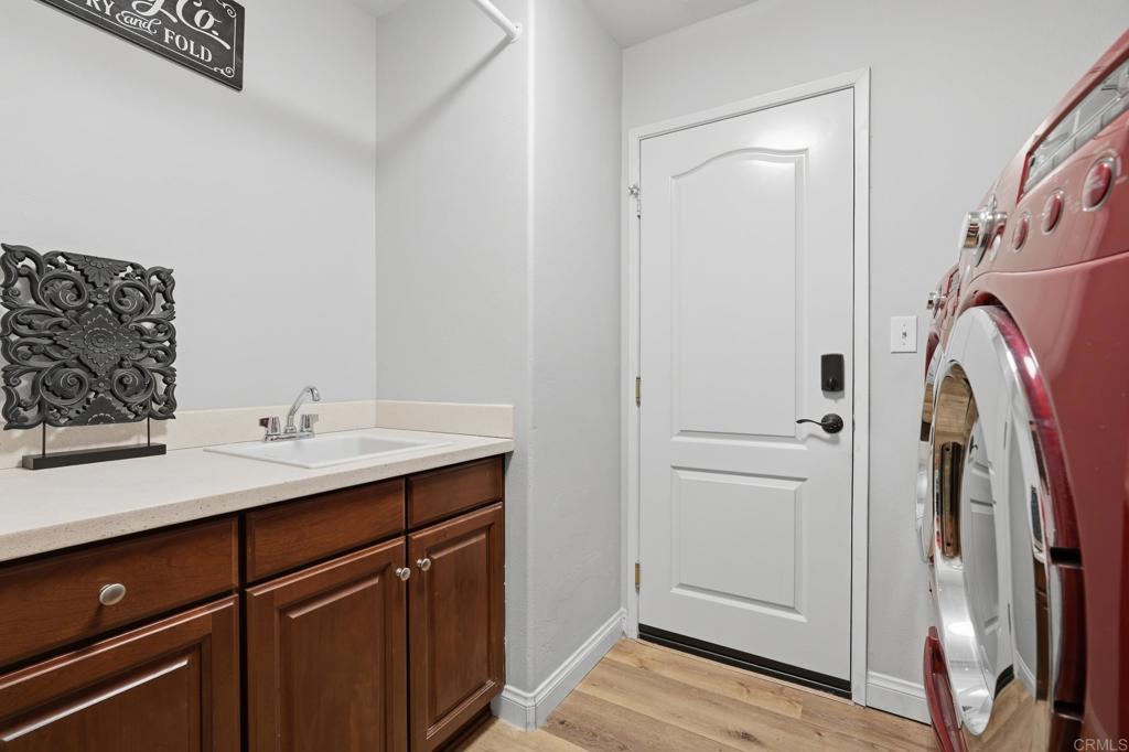 321 William Pittenger Place Fallbrook, CA 92028 - Photo 21 of 32 a bathroom with a sink and a mirror
