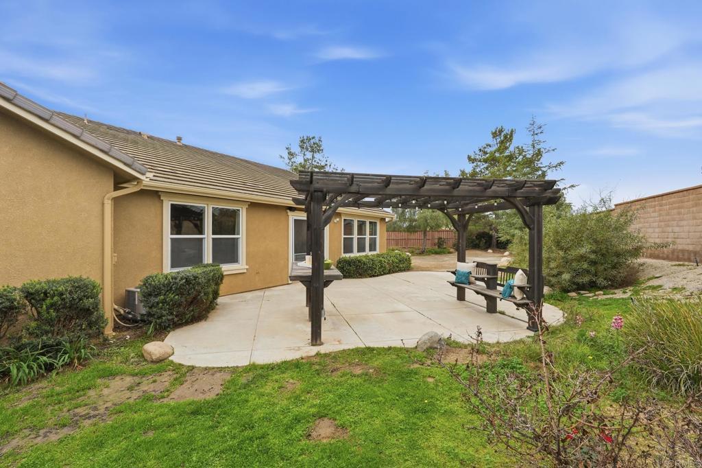 321 William Pittenger Place Fallbrook, CA 92028 - Photo 25 of 32 a front view of a house with a yard