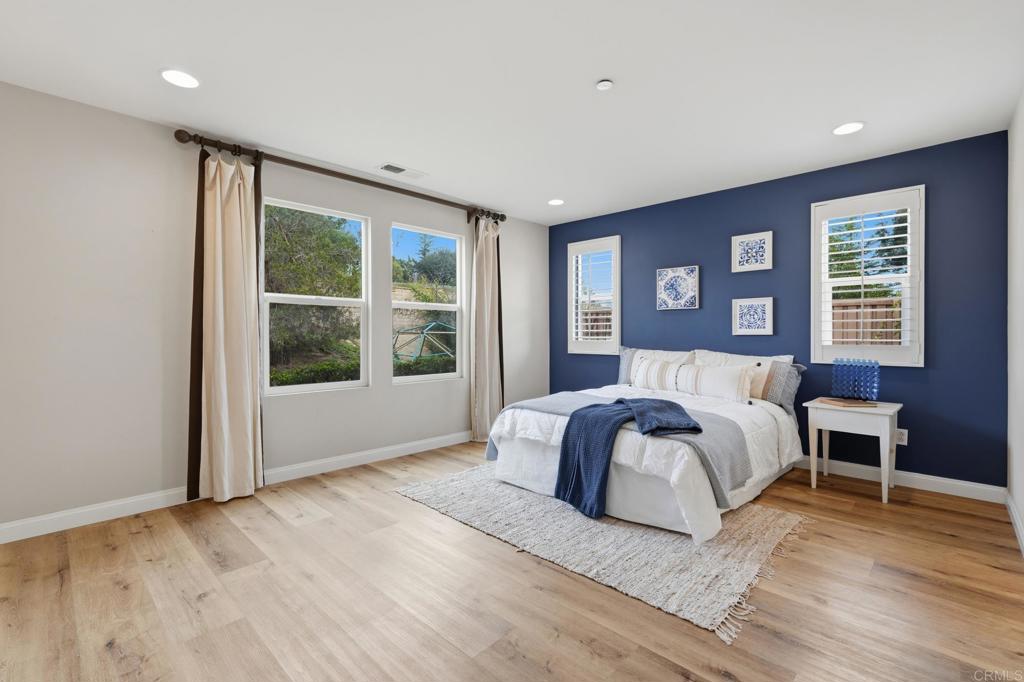 321 William Pittenger Place Fallbrook, CA 92028 - Photo 6 of 32 a spacious bedroom with a large bed and a large window