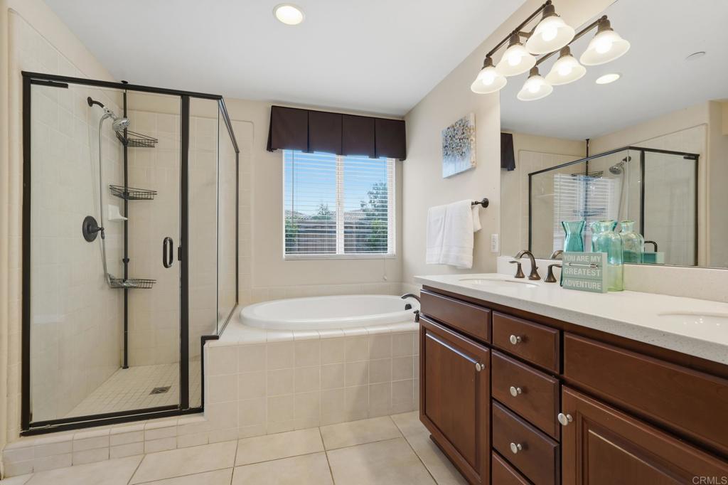 321 William Pittenger Place Fallbrook, CA 92028 - Photo 9 of 32 a bathroom with a tub sink shower and mirror