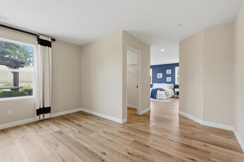 321 William Pittenger Place Fallbrook, CA 92028 - Photo 10 of 32 a view of empty room with wooden floor and fan