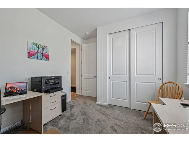 a bedroom with a bed and a cabinets