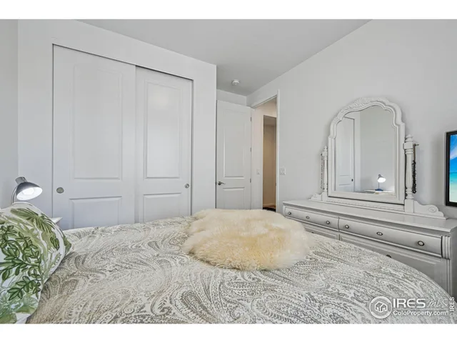 a utility room with dryer washer and a view of living room