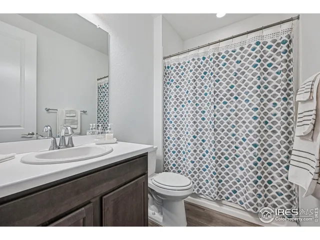 a view of an empty room with a couch