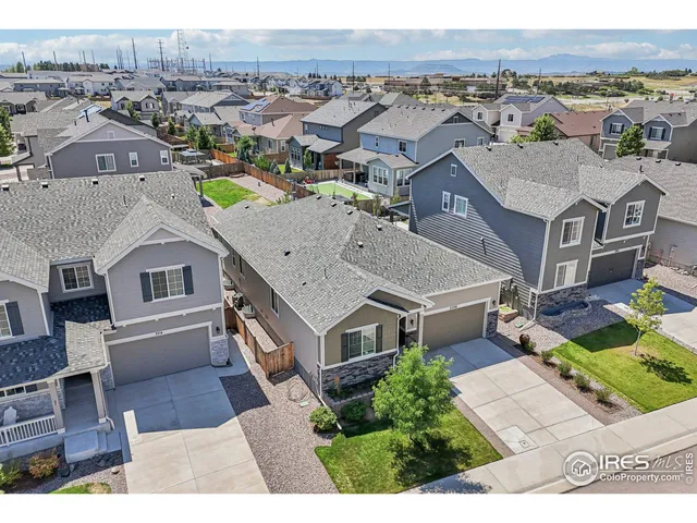 an aerial view of a house with a garden