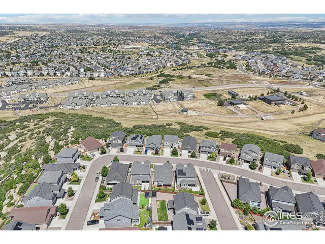 an aerial view of a house with a garden
