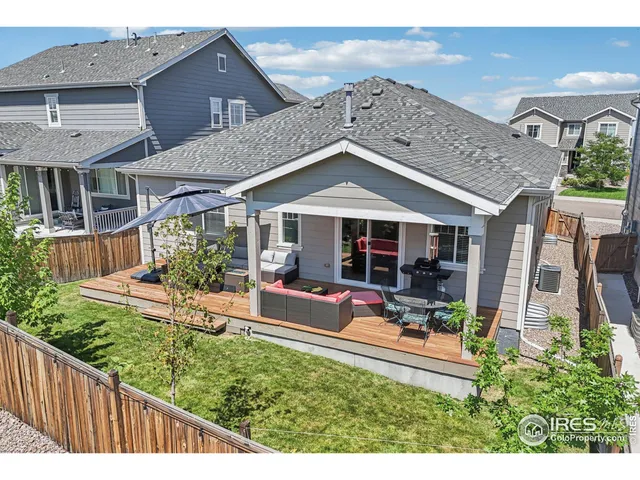 a view of a house with sitting area and garden