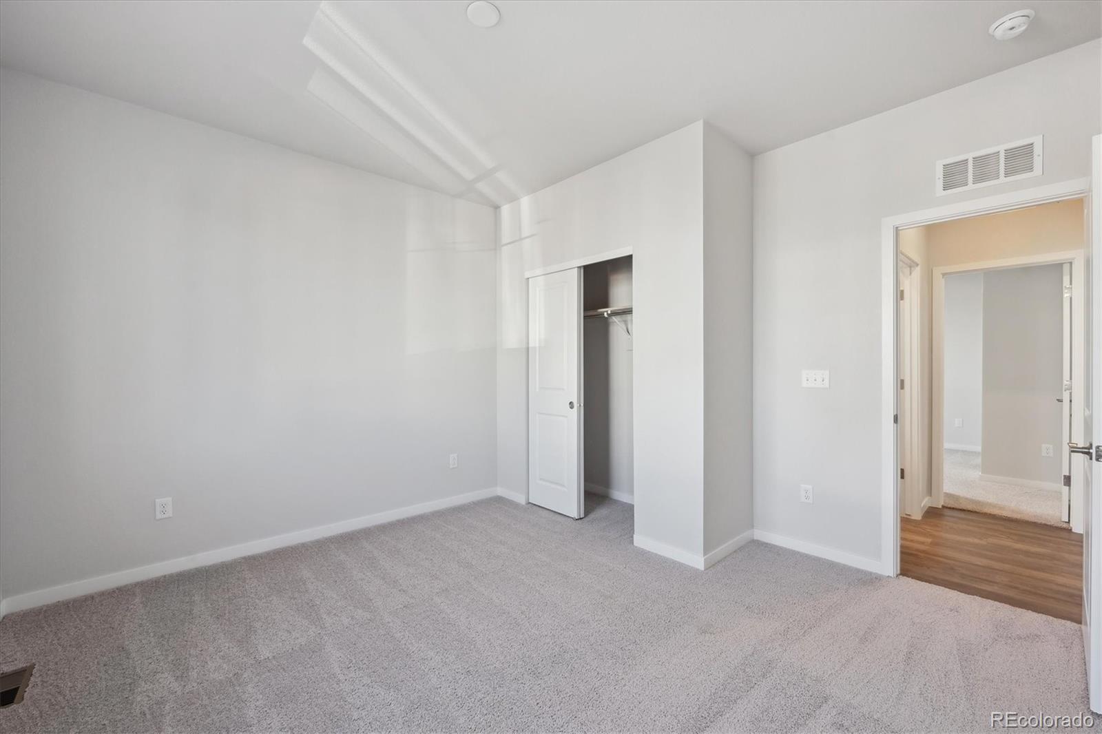 1446 Farmstead Street Brighton, CO 80601 - Photo 11 of 24 a view of an empty room