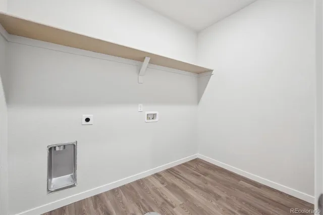 a view of a small space with wooden floor