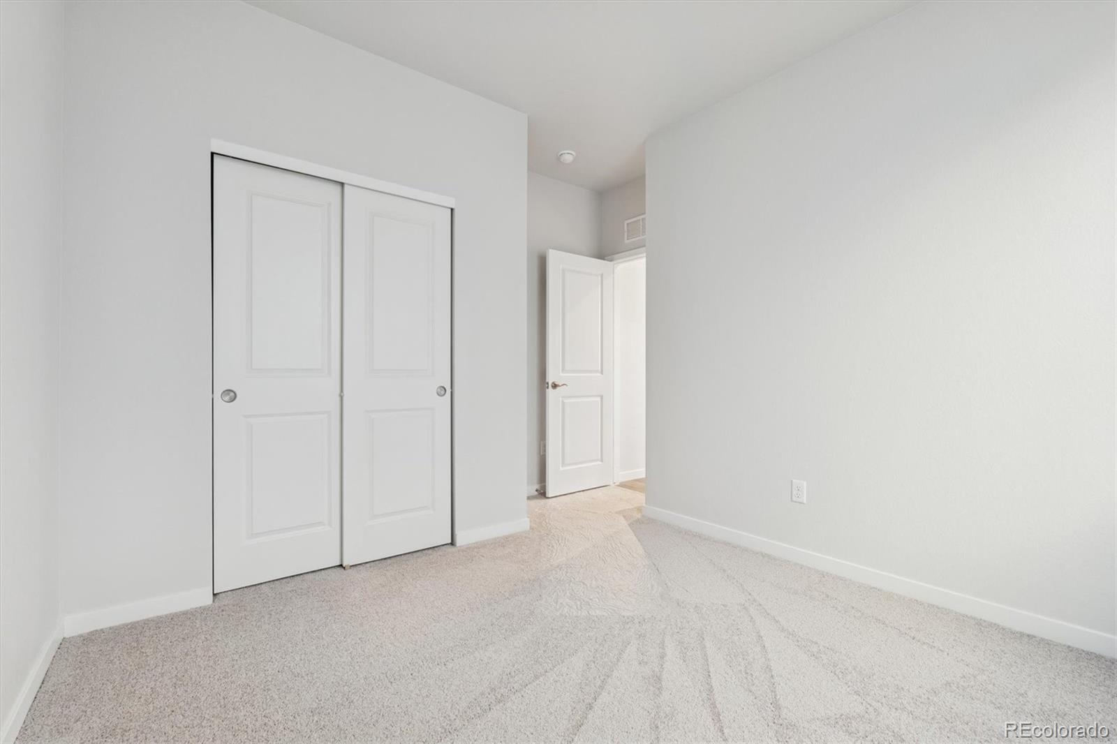 1446 Farmstead Street Brighton, CO 80601 - Photo 19 of 26 a view of an empty room
