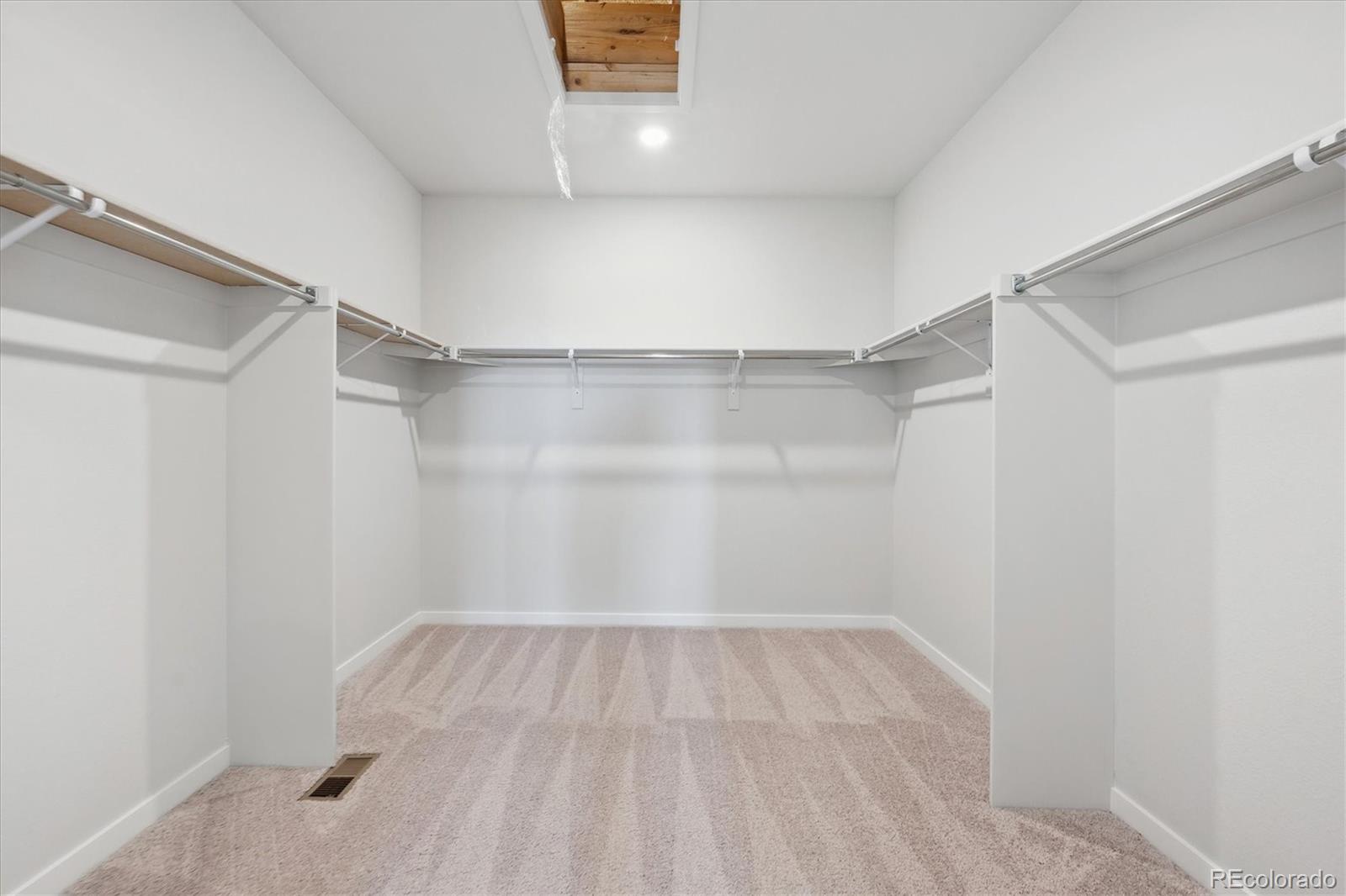 1446 Farmstead Street Brighton, CO 80601 - Photo 22 of 24 a view of a room with wooden floor