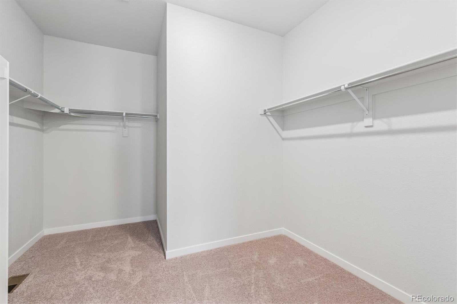 1446 Farmstead Street Brighton, CO 80601 - Photo 24 of 26 a view of an empty walk in closet