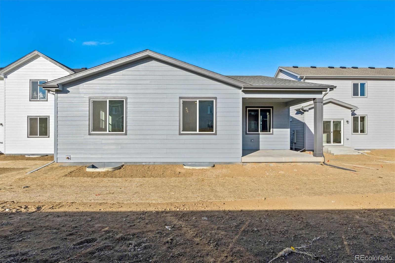1446 Farmstead Street Brighton, CO 80601 - Photo 25 of 26 a front view of a house with a ocean view
