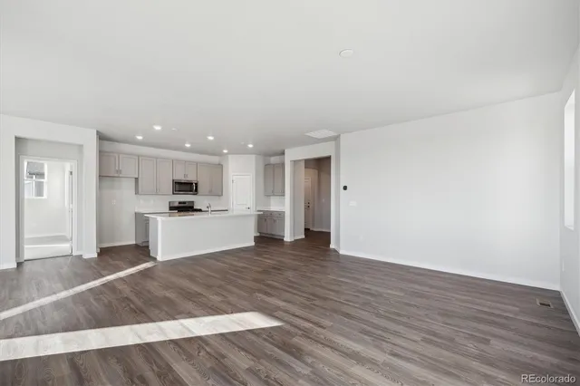 a view of kitchen with wooden floor