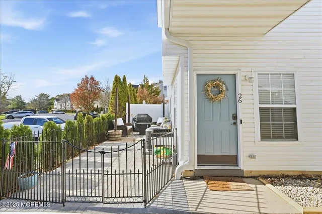 a view of a house with backyard and porch