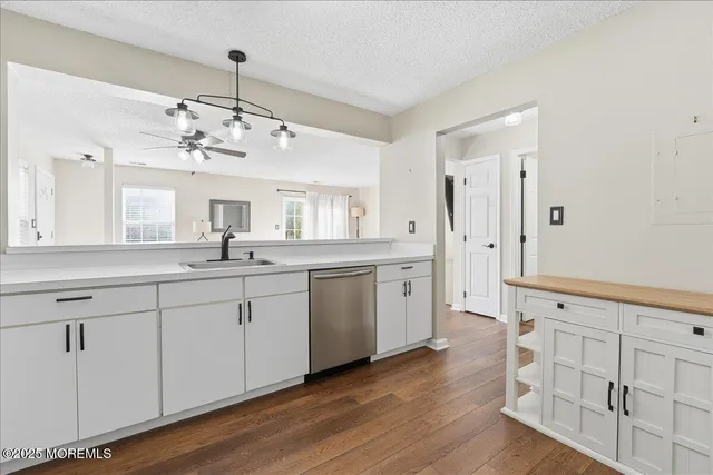 a spacious bathroom with a double vanity sink and a mirror
