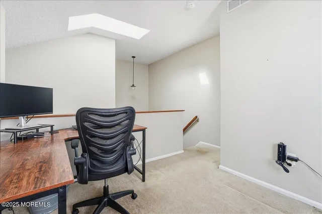 a view of workspace with lounge chair