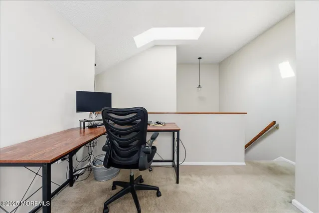a view of a workspace with furniture