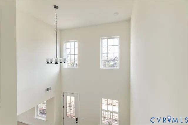 a view of a hallway with windows