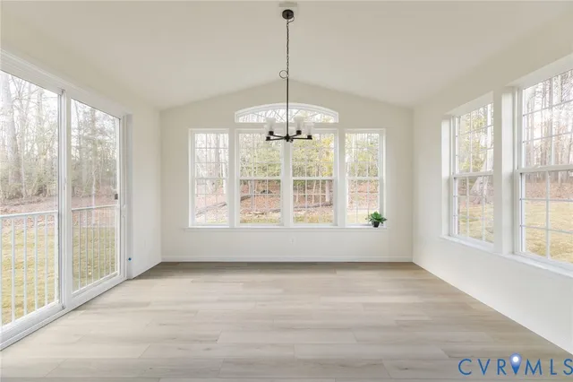 a view of an empty room with windows