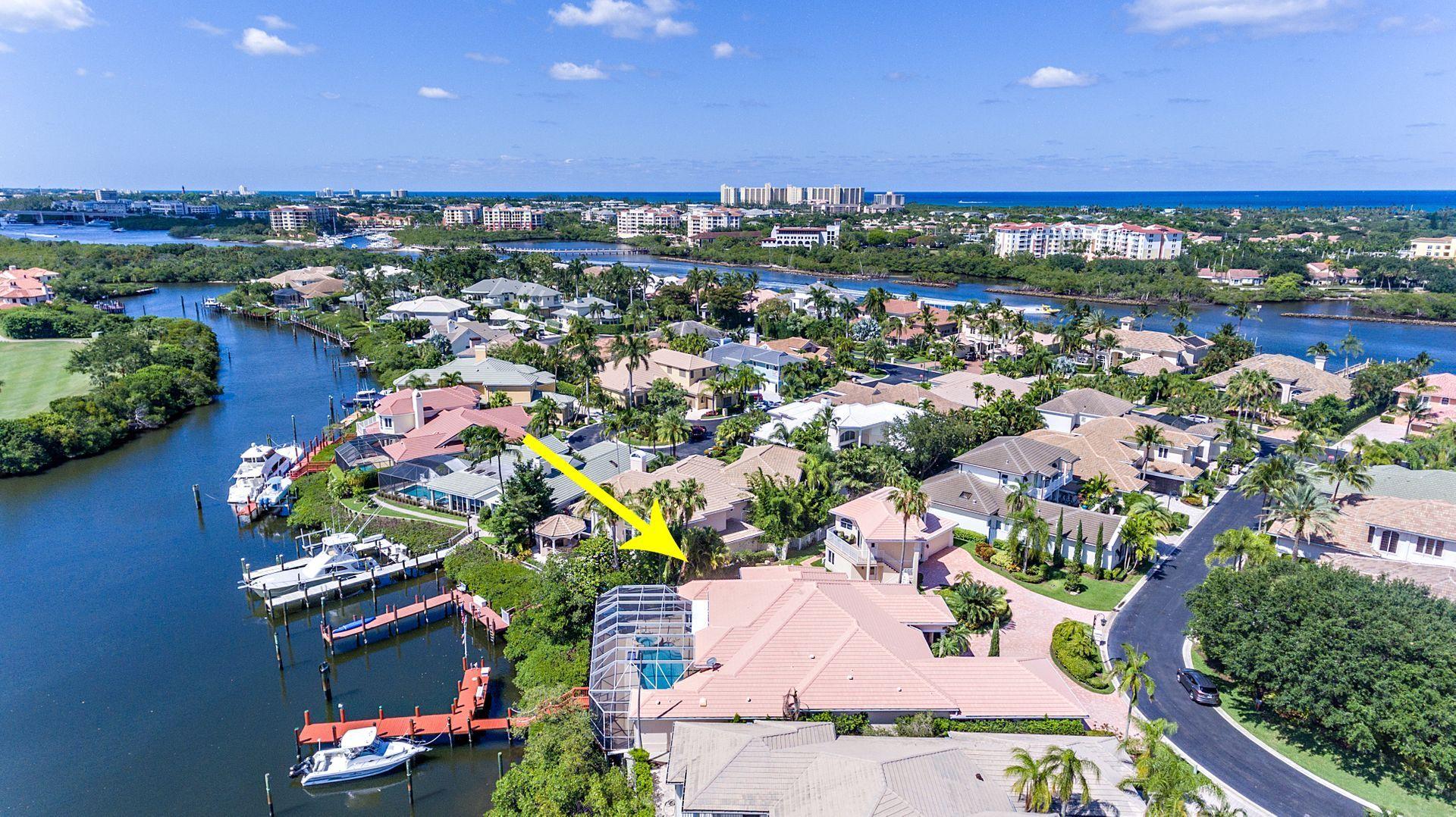 16757 Port Royal Circle Jupiter, FL 33477 - Photo 2 of 65 an aerial view of a residential houses with outdoor space and swimming pool