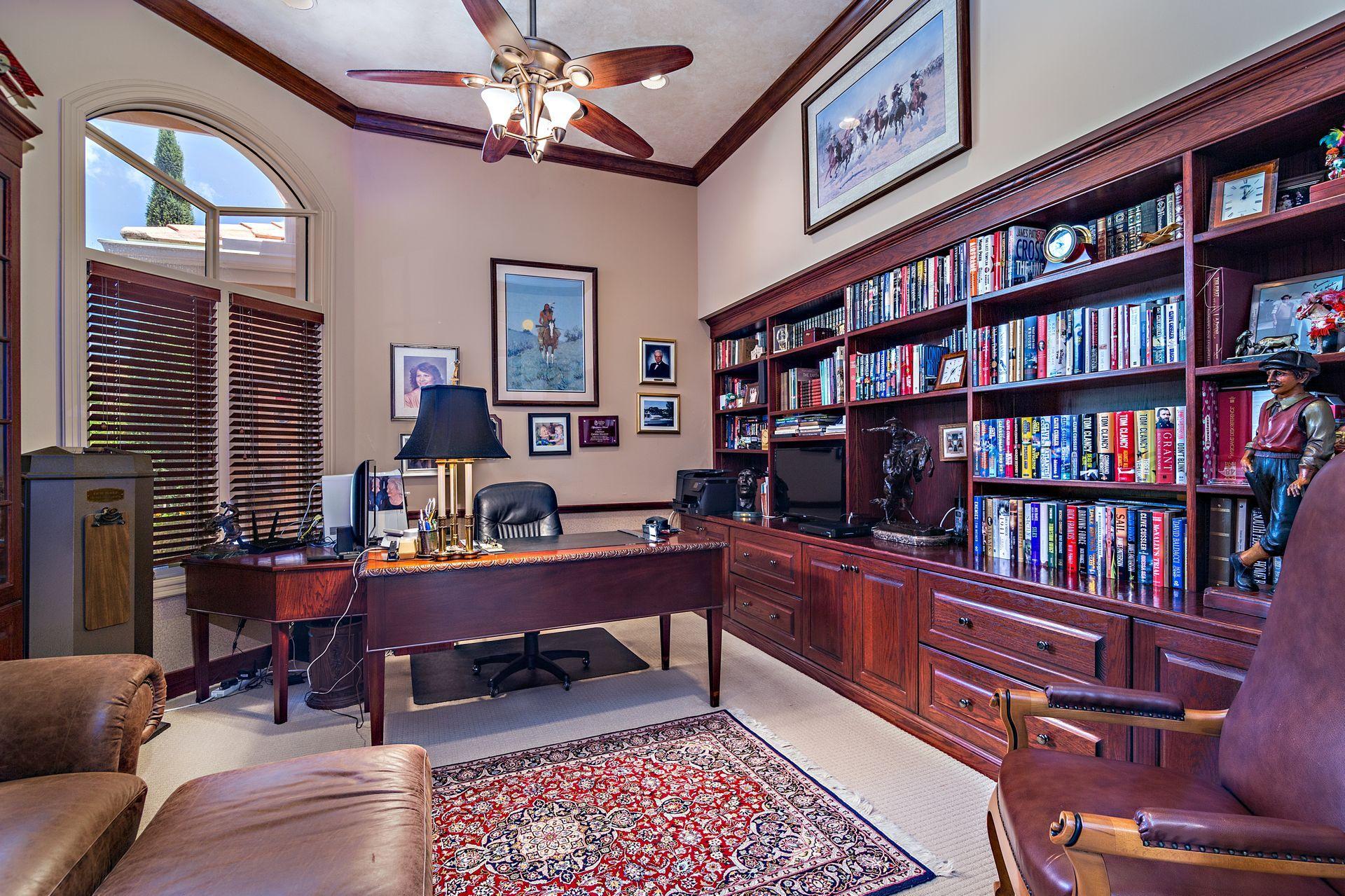 16757 Port Royal Circle Jupiter, FL 33477 - Photo 22 of 65 a reading room with furniture book shelf and a window