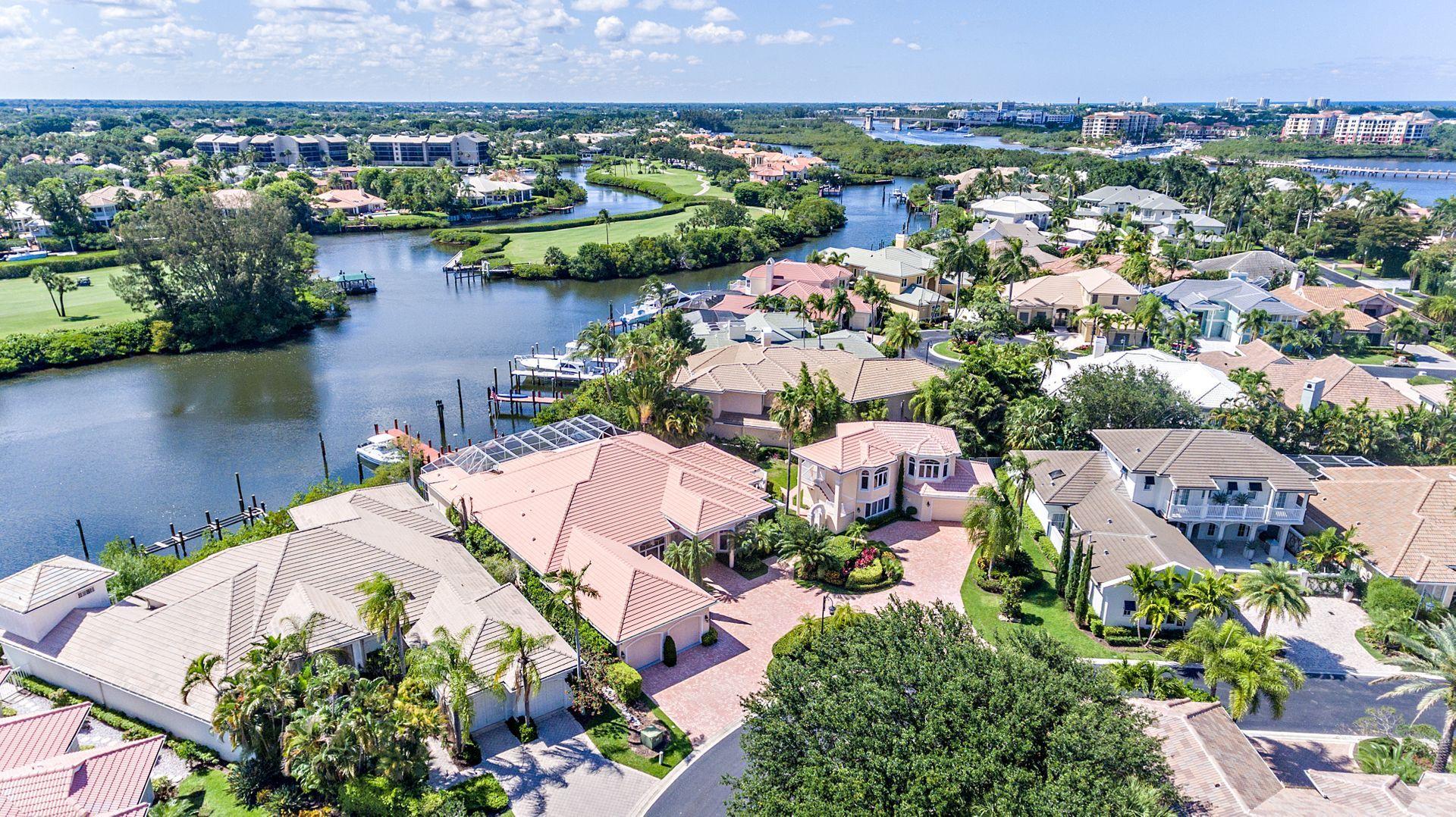 16757 Port Royal Circle Jupiter, FL 33477 - Photo 61 of 65 an aerial view of a house with a lake view