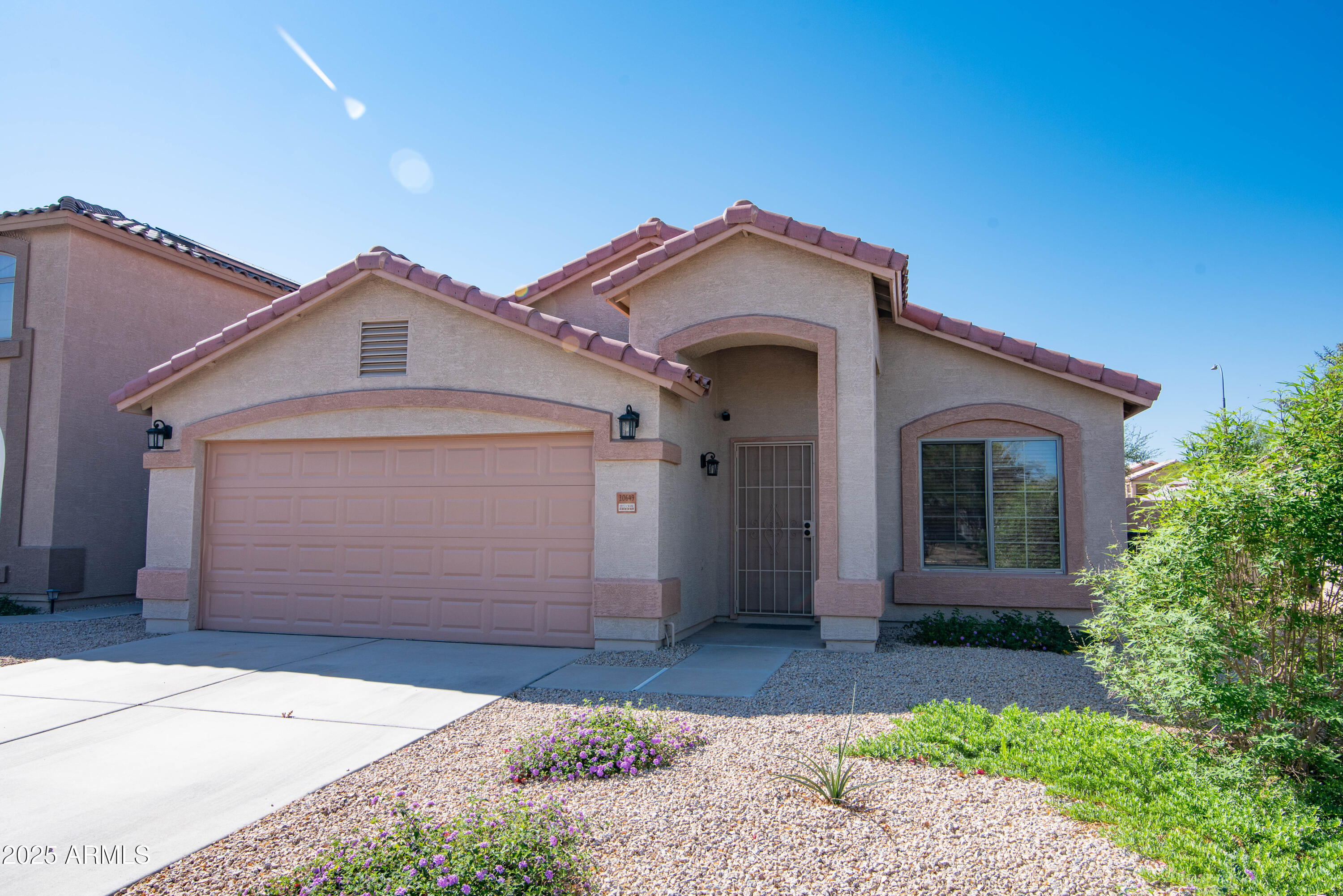 a front view of a house with a garage